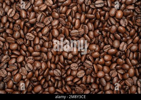 A pile of freshly roasted coffee beans. top view Stock Photo