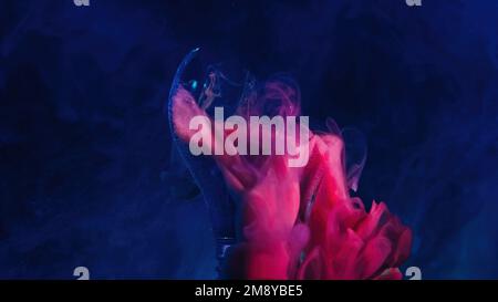Broken lamp color smoke pink blue light bulb dark Stock Photo