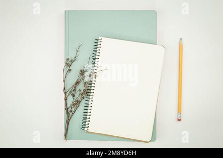 Minimalistic background with blank notepad, flat lay. Stock Photo