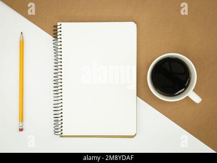 Blank notepad, coffee cup and pencil, flat lay. Stock Photo