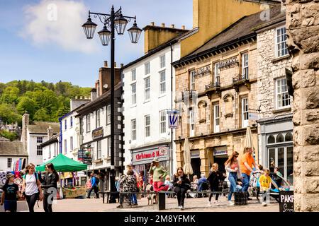 14 May 2022: Kendal, Cumbria, UK - Stricklandgate and the Westmorland Shopping Centre, people out shopping and enjoying the spring sunshine. Stock Photo