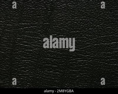 Luxury black genuine leather texture sample. Background with copy space, top view. Leather pattern in dark tone. Faux eco leather. Backdrop textured Stock Photo