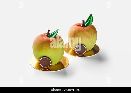 Apple shaped pastries on golden cardboard on white Stock Photo