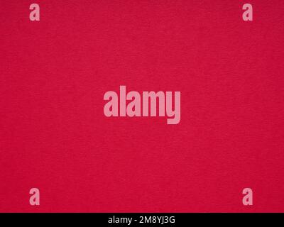 Extra soft red paper, background. Designer cardboard. Texture for making winter season Christmas festival card sheet, text, lettering, 3d, matte, wall Stock Photo