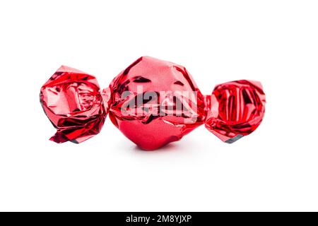 Sweet candy wrapped in foil isolated on the white background. Stock Photo