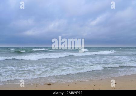 Rolling waves on sandy beach Baltic Sea Stock Photo