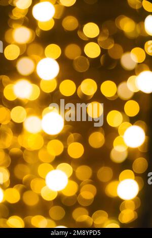 Abstract bright background, bokeh of burning yellow light bulbs Stock Photo