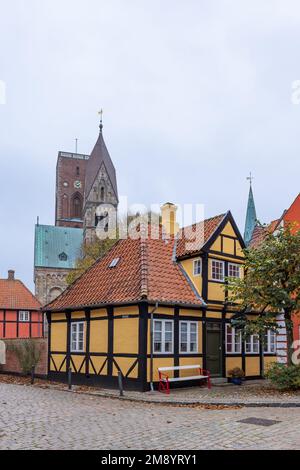 Cityscape with half-timbered house and cathedral in picturesque village Ribe In Southern Jutland in Denmark. Oldest city of Scandinavia Stock Photo