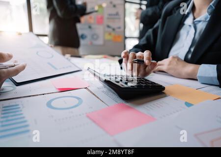 Accounting fund managers meeting to planning to improve quality next year team consultation investment stock market analysis and checking document Stock Photo