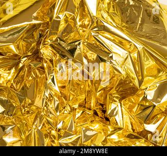 full frame creased gold foil background Stock Photo