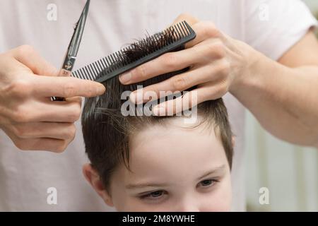 A Little Boy in a Hairdressing Salon Stock Photo