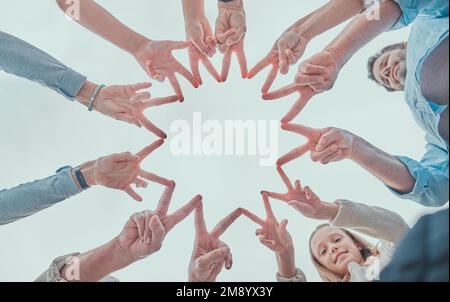 Know that youre a star. a family making a star shape with their hands outside. Stock Photo