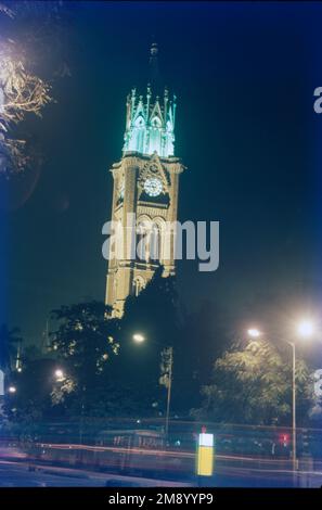 The Rajabai Tower is a clock tower in South Mumbai India. It is in the confines of the Fort campus of the University of Mumbai. It stands at a height of 85 m. The tower is part of The Victorian and Art Deco Ensemble of Mumbai, which was added to the list of World Heritage Sites in 2018. The 142-year-old Rajabai Clock Tower in South Mumbai's Fort area, located inside University of Mumbai's campus, is iconic for its Victorian-Gothic architecture. Built in 1878 by architect Sir George Gilbert Scott, it was commissioned by businessman Premchand Roychand as a tribute to his mother, hence the name. Stock Photo