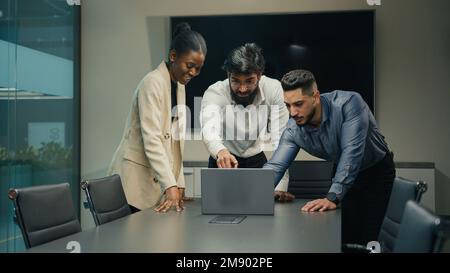 Success business team multiracial diverse people office workers group with laptop win celebrate corporate successful deal growth winning victory great Stock Photo