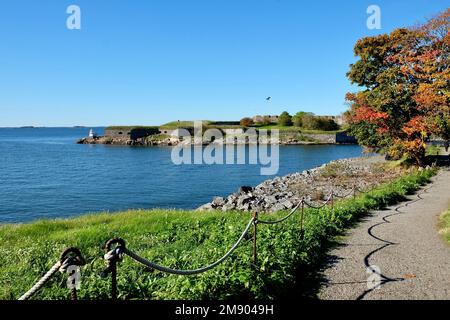 View from the Vallisaari island to the Suomenlinna island with autumn colored tree on the side Stock Photo