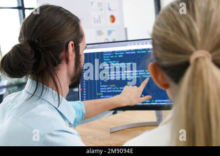 Professional development programers programming game software or developing code for shopping online financial data security system network working at Stock Photo