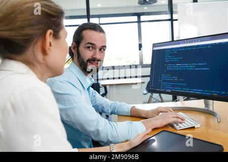 Professional development programers programming game software or developing code for shopping online financial data security system network working at Stock Photo