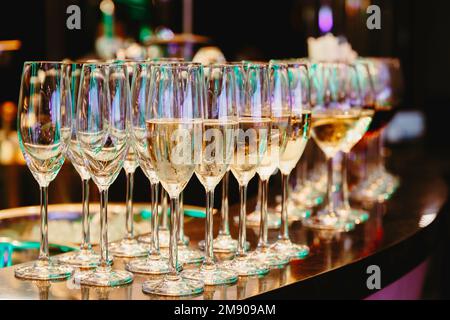 Champagne Flute Glass and wine glass on the counter bar ready to serve and drink in the party. Celebration and party concept. Stock Photo