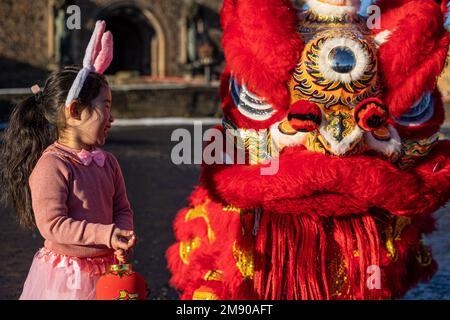 Edinburgh, United Kingdom. 16 January, 2023 Pictured: L to R Annabelle Ye (5 years old) with the Chinese Dragon. Organisers of Edinburgh’s Chinese New Year Festival announce a full programme of events and activities across the city to celebrate Chinese New Year and the start of The Year of the Rabbit.   Stock Photo