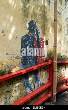 Kuala Lumpur, Malaysia  - December 12th , 2022 : KWAI CHAI HONG, alley behind Petaling Street with murals depicting the daily life  in the old days. Stock Photo