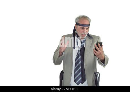 crazy mature man with beard in a suit and many ties standing on a white background Stock Photo