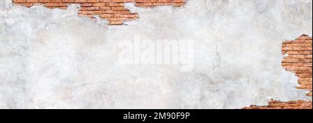 Damaged plaster on brick wall background. Brickwork under crumbling texture  concrete surface Stock Photo