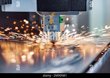 CNC Laser cutting of metal, modern industrial technology Making Industrial Details. The laser optics and CNC (computer numerical control) are used to Stock Photo