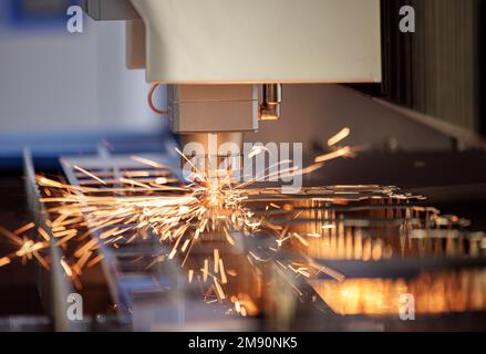 CNC Laser cutting of metal, modern industrial technology Making Industrial Details. The laser optics and CNC (computer numerical control) are used to Stock Photo