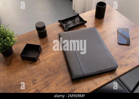 leather folder for documents on the desktop in the office Stock Photo