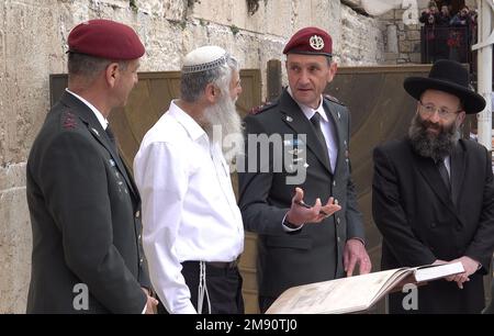 JERUSALEM, ISRAEL - JANUARY 16: The new IDF Chief of Staff Herzi Halevi and his predecessor, Lt. General Aviv Kochavi speak with Rabbi of the Western Wall and the Holy Sites Shmuel Rabinovitch and Mordechai Eliav, director of the Western Wall Heritage Foundation during their visit at the Western Wall, the holiest place where Jews can pray on January 16, 2023, in Jerusalem, Israel. Herzi Halevi was sworn in today as the new chief of staff of the Israel Defense Forces, Credit: Eddie Gerald/Alamy Live News Stock Photo