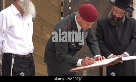 JERUSALEM, ISRAEL - JANUARY 16: Lt. General Aviv Kochavi signs a guest book during a visit with the new IDF Chief of Staff Herzi Halevi at the Western Wall, the holiest place where Jews can pray on January 16, 2023, in Jerusalem, Israel. Herzi Halevi was sworn in today as the new chief of staff of the Israel Defense Forces, He was raised with a Jewish religious-nationalist background and lives in a Jewish settlement in the West Bank. Credit: Eddie Gerald/Alamy Live News Stock Photo