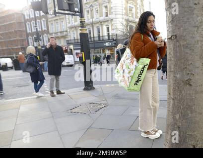 London, England, UK. People using their mobile phones in central London Stock Photo