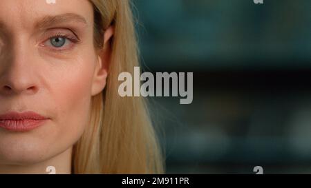 Half female face part middle-aged Caucasian woman adult 40s lady businesswoman looking at camera indoors. Close up cropped view 45s mature executive Stock Photo