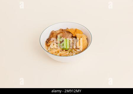 Cao Lau Hoi An, Vietnamese rice noodle with pork, Vietnamese food isolated on white background, perspective view Stock Photo