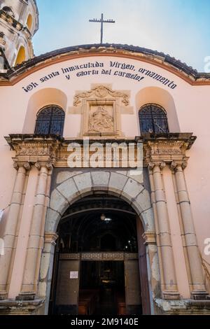 Facade of the Church or Temple of Carmen de Abajo in Oaxaca, Mexico.  Originally built in the 16th Century and dedicated to Our Lady of Carmen.  Part Stock Photo