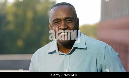 Close up male portrait in city outdoors African American mature senior man ethnic middle-aged adult elderly businessman entrepreneur employer boss Stock Photo