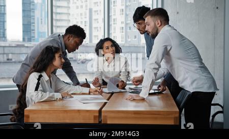 Business teamwork in boardroom. Multiethnic people company workers employers together discuss project work with startup strategy. Multiracial team Stock Photo