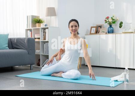 Young woman yoga at home Stock Photo