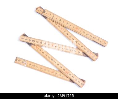 Old folding wooden ruler, isolated on white Stock Photo