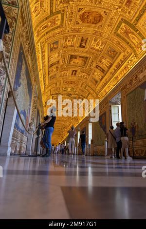 Vatican city museum. Gallery of maps. Hall with marble floor and gold ceiling. Rome, Vatican July 9, 2021 Stock Photo