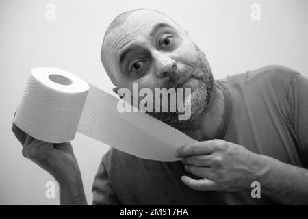 Man during a crisis in the bathroom Stock Photo