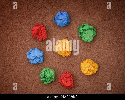Colorful crumpled paper balls on a cork board. Idea Concept. Stock Photo