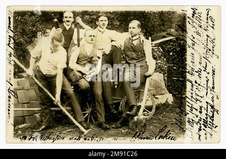 wealthy German men posing next to cart and tiles, holding tools. Maybe a building project they are financing. They are dressed expensively in suits, shiny shoes, waistcoats so are not manual labourers. Posted 28 June 1911 from Schmölln, Bautzen, in Saxony, Germany. Europe. Stock Photo