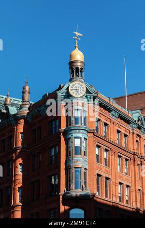 Historic SunTrust building with the clock tower in Washington DC downtown. Historic red brick building with gold-domed clock tower bearing ornamentati Stock Photo