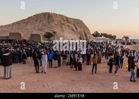 ABU SIMBEL, EGYPT - FEB 22, 2019: Crowds of people waiting in front of the Great Temple of Ramesses II  in Abu Simbel, Egypt. February 22 is a special Stock Photo