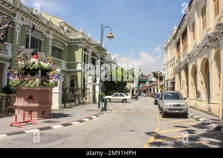 Georgetown, Penang, Malaysia - November 2012: A street lined with vintage colonial architecture in George Town in Penang. Stock Photo