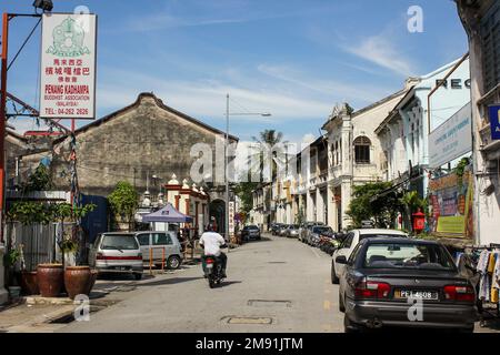 Georgetown, Penang, Malaysia - November 2012: A street lined with vintage colonial architecture in George Town in Penang. Stock Photo