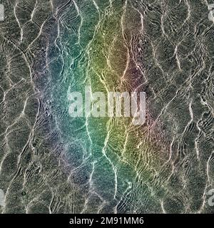rainbow reflection on the water in the swimming pool Stock Photo