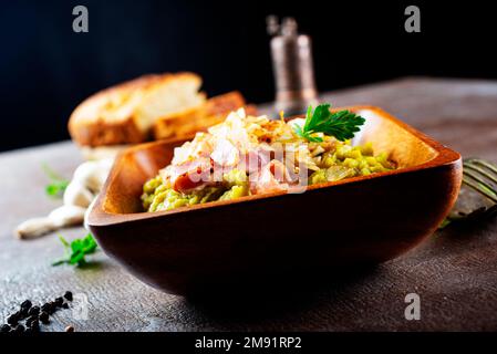 mashed split peas in a bowl on a gray background Stock Photo