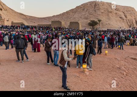 ABU SIMBEL, EGYPT - FEB 22, 2019: Crowds of people waiting in front of the Great Temple of Ramesses II  in Abu Simbel, Egypt. February 22 is a special Stock Photo